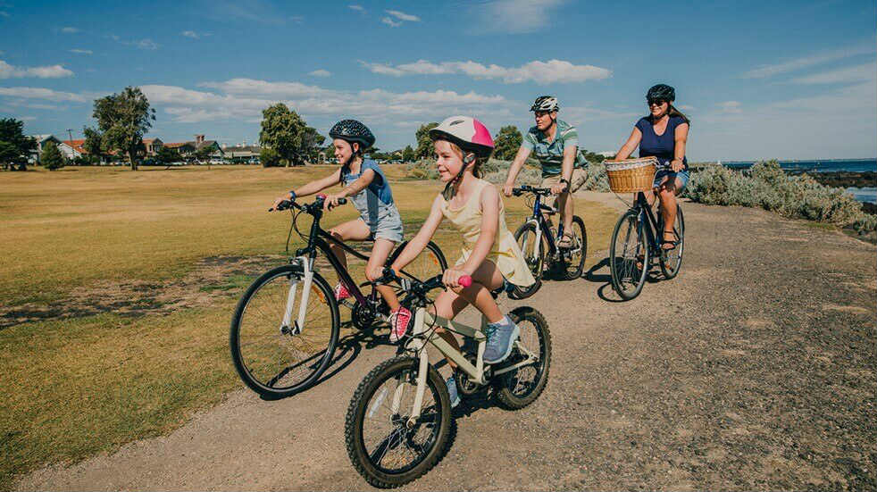 Get fit as a family - children and parents riding bikes